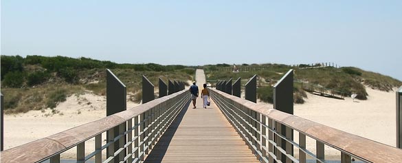 Couple walking on footbridge